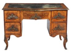 A South German walnut serpentine fronted desk , second quarter 18 th century , the gilt tooled