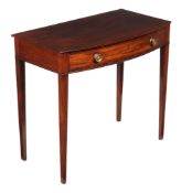 A George III mahogany bowfront side table, circa 1800, the shaped top with moulded edge above a