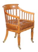 A William IV solid birds eye maple tub armchair, circa 1835, the shaped back incorporating