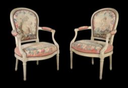 A pair of Louis XVI grey painted and tapestry upholstered armchairs, circa 1775, the moulded frames