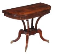 Ω A Regency rosewood card table , circa 1820, the folding D-shaped top enclosing a baize playing