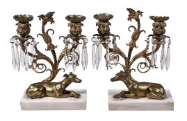 A pair of Regency gilt bronze and marble mounted twin light lustre candelabra, circa 1815, the