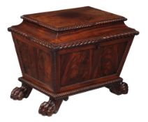 A George IV mahogany wine cooler, circa 1825, of sarcophagus form, the hinged and cavetto moulded