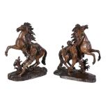 After Guillaume Coustou the Elder, (French 1677 ~ 1746), a pair of patinated bronze models of the