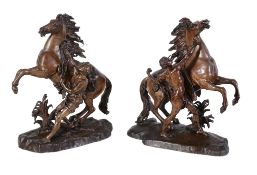 After Guillaume Coustou the Elder, (French 1677 ~ 1746), a pair of patinated bronze models of the