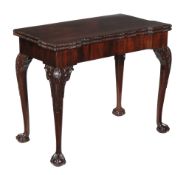 A George II mahogany folding card table, circa 1750, the rectangular top with square outset