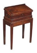 A George III mahogany writing table, circa 1780, possibly of campaign type, the hinged ratchet