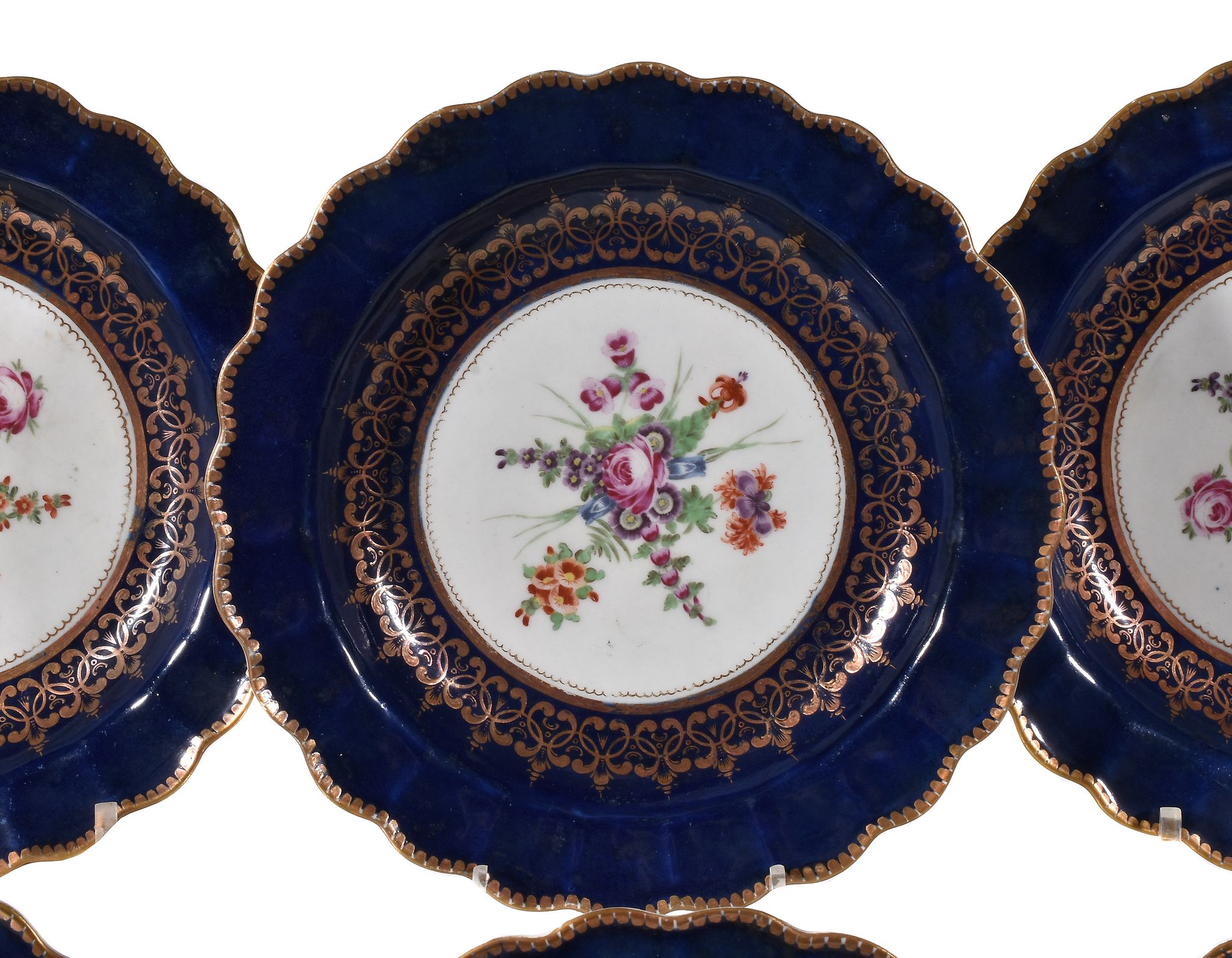 Six Worcester blue-ground plates, circa 1770 , the centres painted with floral sprays within gilt - Image 2 of 3