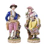 A pair of Minton porcelain models of a gardener and companion, circa 1840, modelled wearing