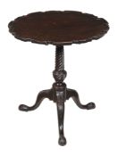 A George III carved mahogany tripod table , circa 1770, the hinged circular shaped top with