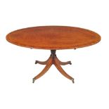 A George III plum pudding mahogany and satinwood crossbanded oval pedestal dining table, circa