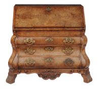 A Dutch walnut serpentine fronted bureau, late 18th century, the hinged fall opening to an