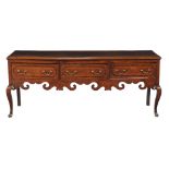 A George II oak and mahogany banded dresser base , circa 1750, with three frieze drawers above a
