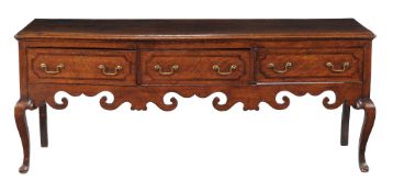 A George II oak and mahogany banded dresser base , circa 1750, with three frieze drawers above a