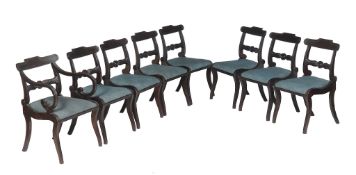 A set of sixteen George IV mahogany dining chairs , circa 1825, to include a pair of armchairs,