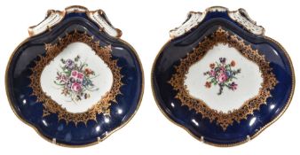 Two similar Worcester blue-ground shell-shaped dishes, circa 1770, the centres painted with floral