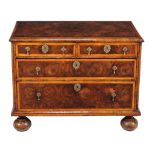 A William & Mary walnut oyster veneered and marquetry chest of drawers, circa 1690, holly banded