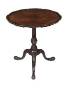 A George III mahogany piecrust tripod table, circa 1770, possibly Irish, the circular shaped top