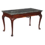 A George II mahogany console table, circa 1740, the serpentine marble top above the moulded frieze
