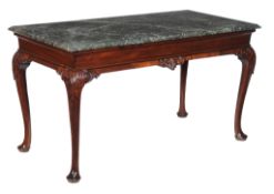 A George II mahogany console table, circa 1740, the serpentine marble top above the moulded frieze