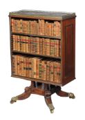 A Regency mahogany and brass marquetry double sided bookstand, circa 1815, the mottled grey marble