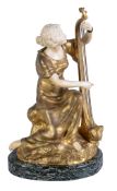 Ω Théophile François Somme, (French 1871-1952), a gilt bronze and carved ivory mounted