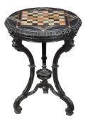 An ebonised and specimen marble chess table, circa 1850, the circular marble top with specimen
