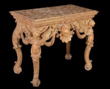 A George I giltwood and gesso console table , circa 1720, the gadrooned oblong top incised with a