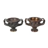 A near pair of patinated bronze models of the Albani Vase, circa 1875, cast after the Antique, each