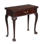 A George II mahogany folding card table, circa 1750, the rectangular folding top opening to a baize