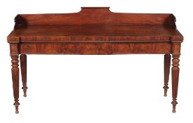 A George IV mahogany serving table, circa 1825, attributed to Gillows. the shaped three quarter