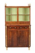 Ω A Regency rosewood and parcel gilt cabinet bookcase, circa 1815, inlaid with stringing