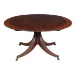 A George III mahogany circular dining table, circa 1790, the circular top with bookmatched centre