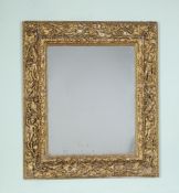 An Italian carved giltwood frame, Bolognese, circa 1600 , the frame carved profusely with fruiting
