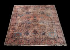 A Tabriz carpet, finely decorated throughout with floral branches and foliage on a pale field,