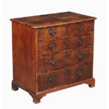 A George I walnut chest of drawers, circa 1720, the quarter veneered and featherbanded top above