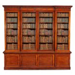 A William IV mahogany library bookcase , circa 1835, the moulded cornice with a moulded roundel