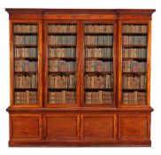 A William IV mahogany library bookcase , circa 1835, the moulded cornice with a moulded roundel
