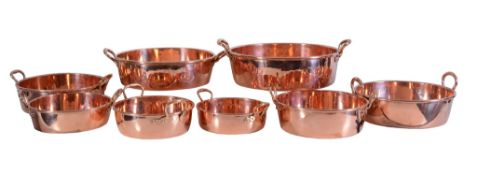 A graduated set of eight Victorian copper twin handled preserving pans, third quarter 19th century,