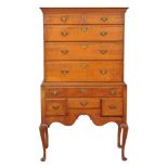 An American tiger maple chest on stand, second quarter 18th century, New England, possibly Rhode