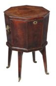 A George III mahogany cellaret , circa 1780 of octagonal tapering form, the lid enclosing a lined