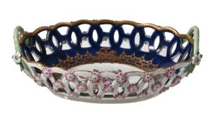 A Worcester blue-ground and gilt pierced-oval two-handled basket, circa 1770, the well painted with