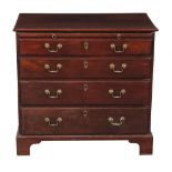 A George III mahogany chest of drawers, circa 1780, the brushing slide above four long graduated