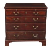 A George III mahogany chest of drawers, circa 1780, the brushing slide above four long graduated