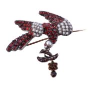 A Victorian Bohemian garnet and half pearl dove brooch, circa 1870, set with rose cut garnets and