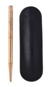 A gold coloured Baker's Pointer Pencil, retailed by Asprey, of polished form engraved with initials