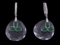 A pair of rock crystal and emerald earrings, the facetted rock crystal drops each set with a trio