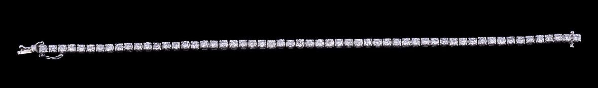 A diamond line bracelet, set with fifty seven brilliant cut diamonds, approximately 2.80 carats