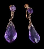 A pair of amethyst earrings, the facetted amethyst drops, suspended below a facetted amethyst bead,