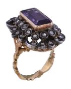 An amethyst and diamond dress ring, the rectangular cut amethyst collet set within a surround of